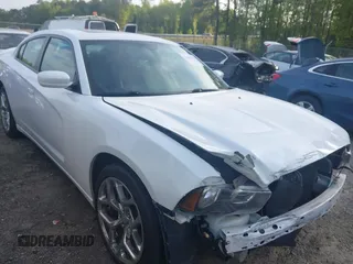 2014 Dodge Charger SXT with VIN 2C3CDXHG4EH337807, listed as a IAAI auction lot 42027319 with 151,988 mi miles. Bid and sale history available at carsss.com. Image 1.