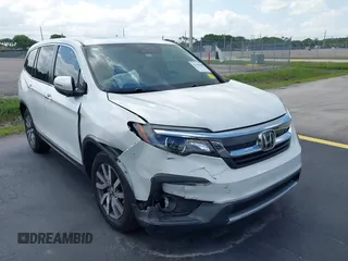 2020 Honda Pilot EX-L with VIN 5FNYF5H59LB028268, listed as a IAAI auction lot 42355620 with 107,033 mi miles and . Bid and sale history available at DreamBid. Image 6.