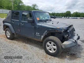 2007 Jeep Wrangler Unlimited X with VIN 1J4GA39117L119395, listed as a Copart auction lot 52588055 with 160,335 mi miles and Salvage title. Bid and sale history available at DreamBid. Image 4.