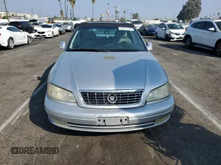 2000 Cadillac Catera z VIN W06VR54R1YR003905, wystawiony jako Copart lot #76417144 z przebiegiem 80 894 mil mil oraz Tytuł czysty. Historia ofert i sprzedaży dostępna na DreamBid. Obrazek 5.
