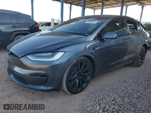 2023 Tesla Model X with VIN 7SAXCAE5XPF384061, listed as a Copart auction lot 86834084 with 6,974 mi miles and Salvage Title. Bid and sale history available at DreamBid. Image 1.