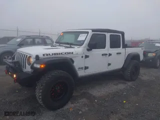 2022 Jeep Gladiator Rubicon with VIN 1C6JJTBG3NL111054, listed as a IAAI auction lot 40793144 with 40,115 mi miles. Bid and sale history available at carsss.com. Image 2.