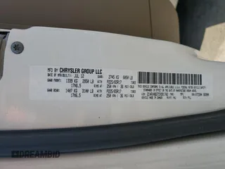 2012 Volkswagen Routan SE z VIN 2C4RVABG7CR391702, wystawiony jako Copart lot #57144765 z przebiegiem 97 122 mil mil oraz Szkoda całkowita • Salvage title. Historia ofert i sprzedaży dostępna na DreamBid. Obrazek 13.