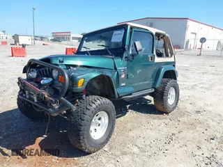 2001 Jeep Wrangler Sahara with VIN 1J4FA59S71P340368, listed as a IAAI auction lot 40148603 with 138,710 mi miles. Bid and sale history available at carsss.com. Image 2.