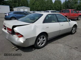 2000 Lexus ES 300 with VIN JT8BF28G6Y5099537, listed as a Copart auction lot 61873595 with 167,090 mi miles and Salvage title. Bid and sale history available at DreamBid. Image 3.