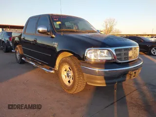2002 Ford F-150 XLT with VIN 1FTRW07622KD31203, listed as a IAAI auction lot 41401506 with 166,949 mi miles. Bid and sale history available at carsss.com. Image 1.
