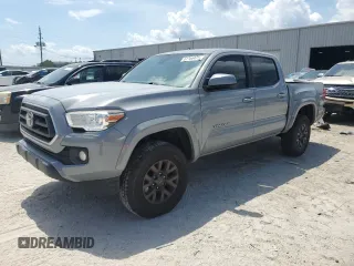 2020 Toyota Tacoma SR5 with VIN 3TMAZ5CN9LM127961, listed as a Copart auction lot 61386475 with 119,602 mi miles and Salvage title. Bid and sale history available at DreamBid. Image 1.