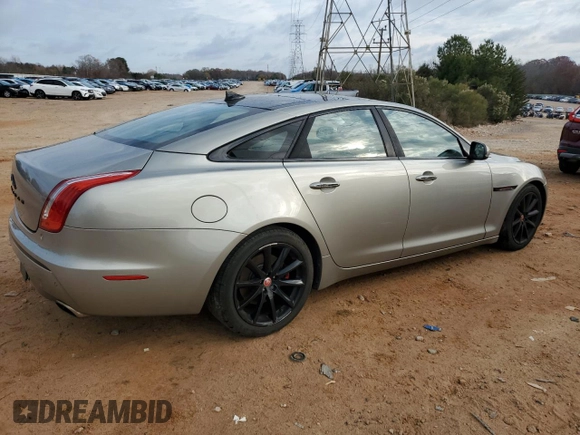 2014 Jaguar XJ with VIN SAJWA1CZ5E8V71971, listed as a Copart auction lot 82116114 with 127,164 mi miles and Salvage Title. Bid and sale history available at DreamBid. Image 3.