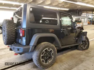 2013 Jeep Wrangler Rubicon with VIN 1C4HJWCG6DL666540, listed as a Copart auction lot 79337404 with 130,448 mi miles and Salvage title. Bid and sale history available at DreamBid. Image 3.