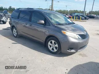 2014 Toyota Sienna LE AAS with VIN 5TDKK3DCXES432611, listed as a IAAI auction lot 40771635 with 214,145 mi miles. Bid and sale history available at carsss.com. Image 1.