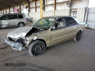2001 Mazda Protege LX with VIN JM1BJ225410449919, listed as a Copart auction lot 51674295 with 148,914 mi miles and Salvage Title. Bid and sale history available at carsss.com. Image 1.