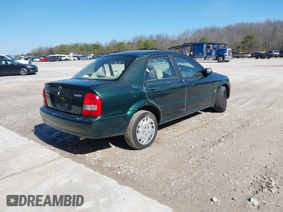 2001 Mazda Protege LX with VIN JM1BJ225310404647, listed as a IAAI auction lot 41480466 with 115,606 mi miles and . Bid and sale history available at carsss.com. Image 4.