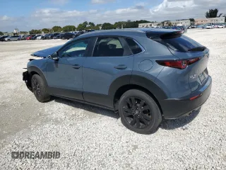 2024 Mazda CX-30 2.5 S Carbon Edition with VIN 3MVDMBCMXRM673483, listed as a Copart auction lot 46810935 with 3,047 mi miles and Salvage Title. Bid and sale history available at carsss.com. Image 2.
