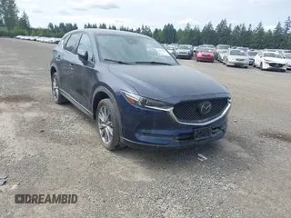 2019 Mazda CX-5 Signature with VIN JM3KFBEY7K0589236, listed as a IAAI auction lot 42078418 with 86,959 mi miles. Bid and sale history available at carsss.com. Image 1.