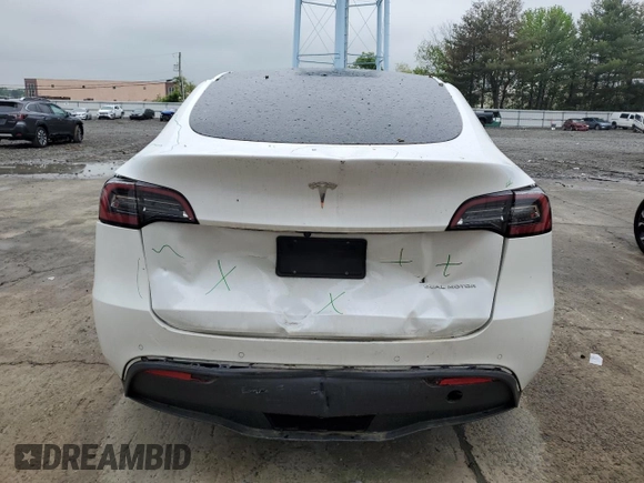 2022 Tesla Model Y Long Range z VIN 7SAYGDEE5NA016276, wystawiony jako Copart lot #55942355 z przebiegiem 14 085 mil mil oraz Szkody całkowita. Historia ofert i sprzedaży dostępna na DreamBid. Obrazek 6.