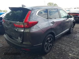 2018 Honda CR-V Touring z VIN 7FARW1H9XJE040530, wystawiony jako IAAI lot #42227446 z przebiegiem 101 299 mil mil oraz . Historia ofert i sprzedaży dostępna na DreamBid. Obrazek 4.