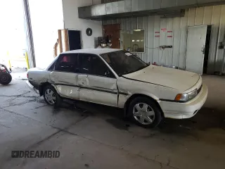 1991 Toyota Camry z VIN 4T1VV21E8MU050409, wystawiony jako Copart lot #61379824 z przebiegiem 100 949 mil mil oraz Nie do naprawy • Non repairable. Historia ofert i sprzedaży dostępna na DreamBid. Obrazek 4.