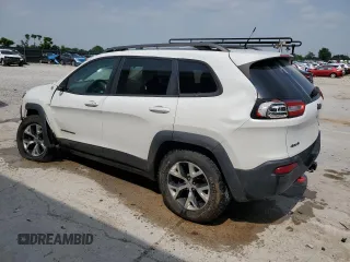 2015 Jeep Cherokee Trailhawk with VIN 1C4PJMBS8FW717950, listed as a Copart auction lot 60321625 with 155,210 mi miles and Salvage title. Bid and sale history available at DreamBid. Image 2.