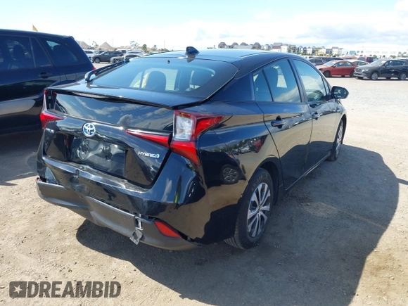 2021 Toyota Prius L Eco with VIN JTDKAMFU6M3135799, listed as a IAAI auction lot 42064241 with 77,120 mi miles and . Bid and sale history available at DreamBid. Image 4.