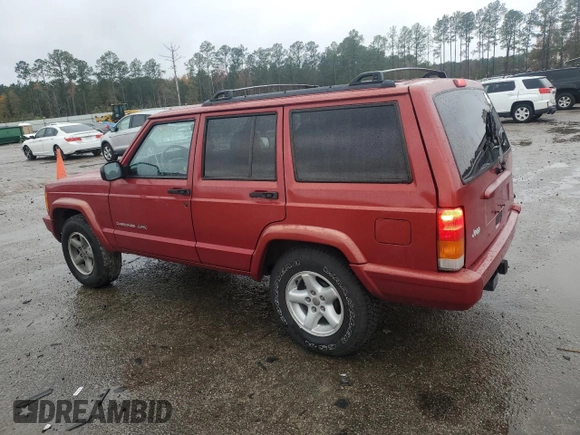1999 Jeep Cherokee Sport with VIN 1J4FT68S1XL601799, listed as a Copart auction lot 83881844 with 203,572 mi miles and Salvage title. Bid and sale history available at DreamBid. Image 2.