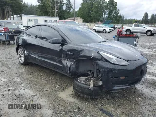 2023 Tesla Model 3 with VIN 5YJ3E1EA2PF457667, listed as a Copart auction lot 57360035 with 53,962 mi miles and Salvage title. Bid and sale history available at DreamBid. Image 4.