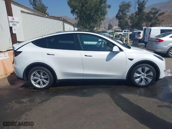 2023 Tesla Model Y Long Range with VIN 7SAYGDEE3PF897016, listed as a IAAI auction lot 40407572 with 8,030 mi miles. Bid and sale history available at carsss.com. Image 14.