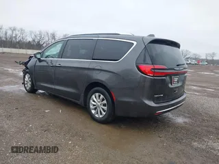 2021 Chrysler Pacifica Touring L with VIN 2C4RC1BG7MR584956, listed as a IAAI auction lot 42016887 with 51,415 mi miles and . Bid and sale history available at DreamBid. Image 3.