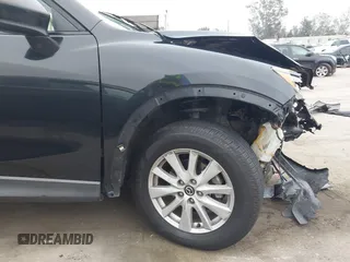 2014 Mazda CX-5 Touring z VIN JM3KE2CY3E0355332, wystawiony jako IAAI lot #42096306 z przebiegiem 108 198 mil mil oraz . Historia ofert i sprzedaży dostępna na DreamBid. Obrazek 19.