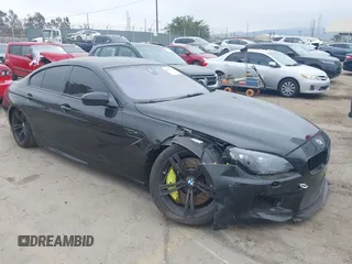 2014 BMW M6 with VIN WBS6C9C57ED467275, listed as a IAAI auction lot 42787711 with 105,158 mi miles and . Bid and sale history available at DreamBid. Image 1.