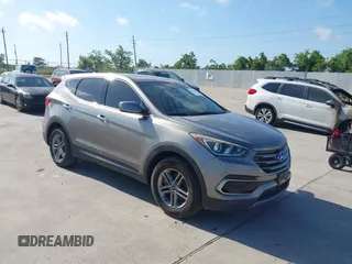 2017 Hyundai Santa Fe 2.4L z VIN 5XYZTDLB7HG444033, wystawiony jako IAAI lot #42263907 z przebiegiem 107 454 mil mil oraz . Historia ofert i sprzedaży dostępna na DreamBid. Obrazek 1.