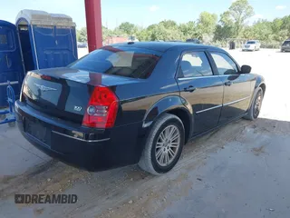 2009 Chrysler 300 Touring with VIN 2C3KA53V59H621936, listed as a IAAI auction lot 42112314 with 198,461 mi miles. Bid and sale history available at carsss.com. Image 4.