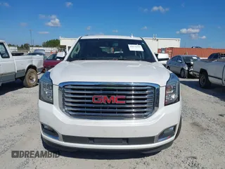 2019 GMC Yukon SLT with VIN 1GKS1BKC9KR332014, listed as a IAAI auction lot 40674460 with 76,545 mi miles. Bid and sale history available at carsss.com. Image 12.