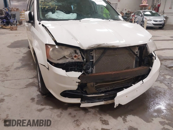2012 Dodge Grand Caravan SXT with VIN 2C4RDGCG3CR405373, listed as a IAAI auction lot 41264407 with 164,019 mi miles and . Bid and sale history available at DreamBid. Image 6.