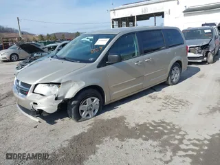 2012 Dodge Grand Caravan SE with VIN 2C4RDGBG3CR385529, listed as a IAAI auction lot 41506810 with 153,300 mi miles. Bid and sale history available at carsss.com. Image 2.