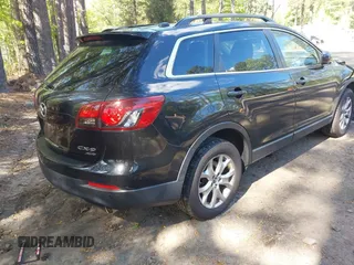 2014 Mazda CX-9 Touring with VIN JM3TB3CV1E0428688, listed as a IAAI auction lot 42052151 with 208,050 mi miles and . Bid and sale history available at DreamBid. Image 4.