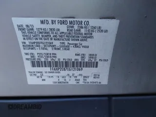 2014 Ford Taurus SEL z VIN 1FAHP2E87EG121069, wystawiony jako IAAI lot #41030422 z przebiegiem 138 043 mil mil oraz . Historia ofert i sprzedaży dostępna na DreamBid. Obrazek 9.