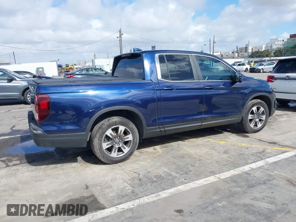 2017 Honda Ridgeline RTL-T with VIN 5FPYK2F68HB001759, listed as a IAAI auction lot 41562343 with 59,633 mi miles and . Bid and sale history available at DreamBid. Image 4.