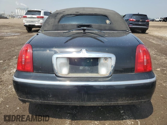 1999 Lincoln Town Car Executive with VIN 1L1FM81W8XY710157, listed as a Copart auction lot 59804965 with Not provided miles and Salvage title. Bid and sale history available at DreamBid. Image 6.