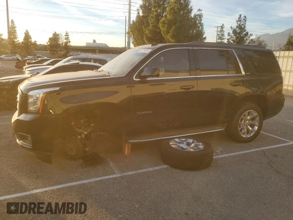 2015 GMC Yukon SLT with VIN 1GKS1BKC9FR144289, listed as a Copart auction lot 42179675 with 122,807 mi miles and Salvage Title. Bid and sale history available at carsss.com. Image 1.