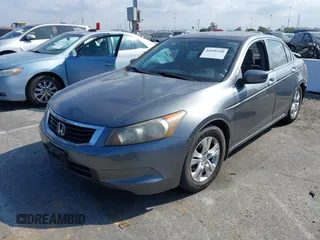 2009 Honda Accord LX-P with VIN JHMCP26459C007437, listed as a IAAI auction lot 41896268 with 221,522 mi miles and . Bid and sale history available at DreamBid. Image 2.