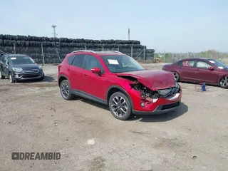 2016 Mazda CX-5 Grand Touring with VIN JM3KE4DY9G0850583, listed as a IAAI auction lot 42075545 with 92,789 mi miles and . Bid and sale history available at carsss.com. Image 1.