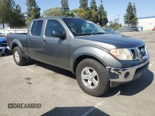 2009 Nissan Frontier LE with VIN 1N6AD09UX9C416211, listed as a Copart auction lot 61655315 with 344,390 mi miles and Salvage title. Bid and sale history available at DreamBid. Image 4.