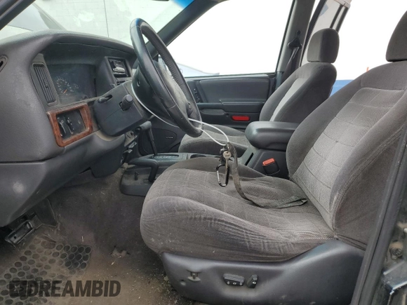 1996 Jeep Grand Cherokee with VIN 1J4EZ58S8TC106529, listed as a Copart auction lot 50163965 with 226,951 mi miles and Salvage title. Bid and sale history available at DreamBid. Image 7.