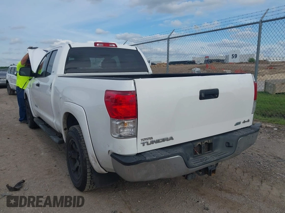 2012 Toyota Tundra with VIN 5TFUW5F16CX225421, listed as a IAAI auction lot 42210783 with 207,025 mi miles and . Bid and sale history available at DreamBid. Image 3.