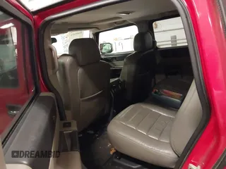 2004 Hummer H2 with VIN 5GRGN23U24H114730, listed as a IAAI auction lot 41605451 with 122,658 mi miles. Bid and sale history available at carsss.com. Image 8.