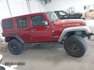 2011 Jeep Wrangler Unlimited Rubicon with VIN 1J4BA6H18BL584486, listed as a IAAI auction lot 42340661 with 152,896 mi miles and . Bid and sale history available at DreamBid. Image 13.