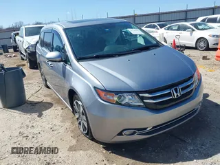 2016 Honda Odyssey Touring Elite with VIN 5FNRL5H96GB090653, listed as a IAAI auction lot 41720195 with 68,969 mi miles. Bid and sale history available at carsss.com. Image 1.