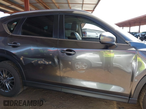 2021 Mazda CX-5 Touring with VIN JM3KFACM2M1313750, listed as a IAAI auction lot 41762938 with 68,503 mi miles. Bid and sale history available at carsss.com. Image 13.