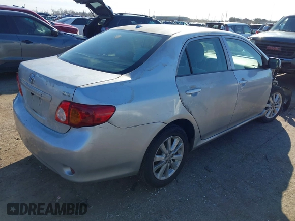 2009 Toyota Corolla with VIN JTDBL40E999021621, listed as a IAAI auction lot 41636462 with 123,650 mi miles. Bid and sale history available at carsss.com. Image 4.