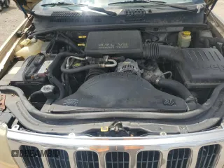 1999 Jeep Grand Cherokee Laredo with VIN 1J4GW58N7XC799434, listed as a Copart auction lot 64790905 with 272,384 mi miles and Salvage title. Bid and sale history available at DreamBid. Image 12.